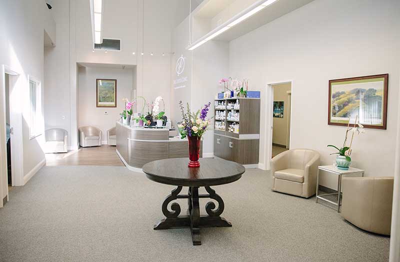 Clean, professional medical spa treatment room with neutral tones at The Lapidus Clinic in Avila Beach